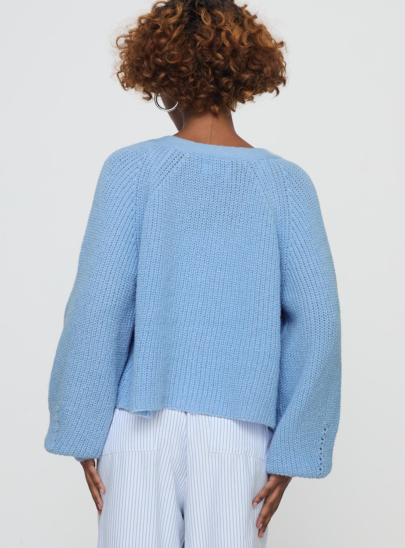 back view of model wearing Princess Polly Leskie Cardigan Pale Blue Cropped 