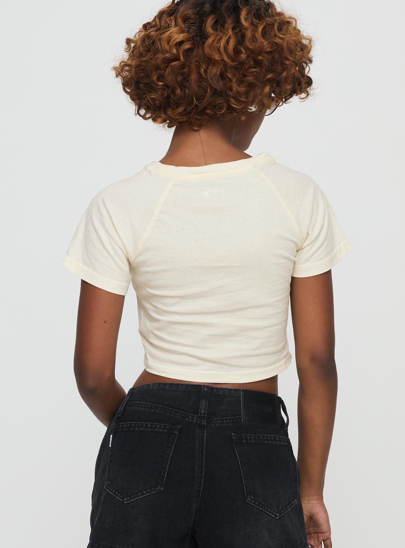back view of model wearing Princess Polly Outta This World Tee Cream Short Sleeves Crew Neck 