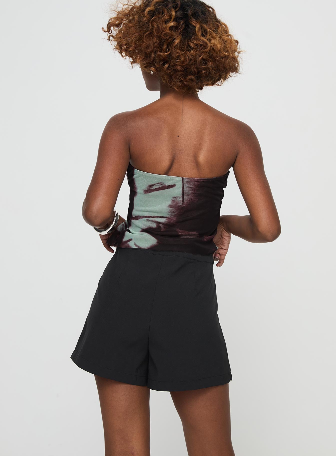 back view of model wearing Princess Polly Castio Skort Black High Waisted Shorts 