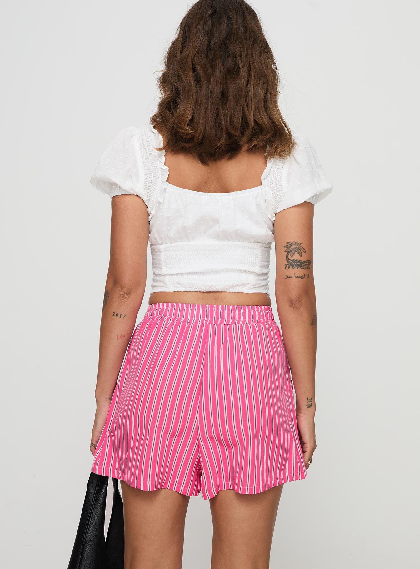 back view of model wearing Princess Polly Miragea Shorts Hot Pink Stripe High Waisted Shorts 