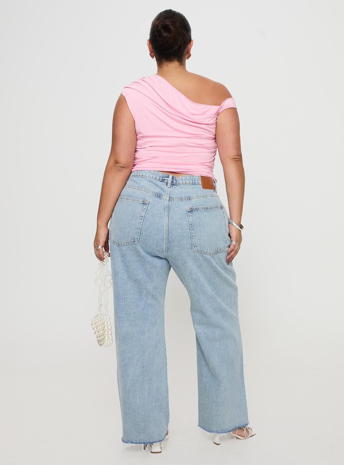 back view of model wearing Princess Polly Fawcett Jeans Light Wash Denim Curve High Waisted 
