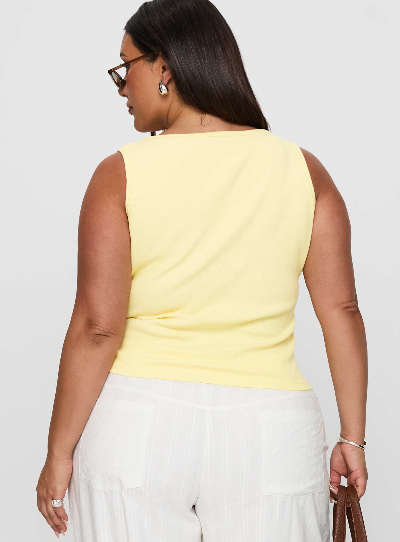 back view of model wearing Princess Polly Baseline Square Neck Rib Tank Top Lemon Curve Sleeveless Square Neck 