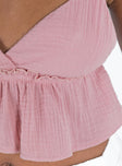Pink crop top Muslin look material  Adjustable shoulder straps  Plunging neckline  Ruffle detail
