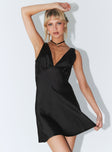 Front view of model wearing  front Princess Polly Asymmetric Neckline  Nellie Mini Dress Black