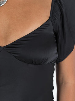 Front view of model wearing  front Princess Polly Asymmetric Neckline  Isabel Mini Dress Black