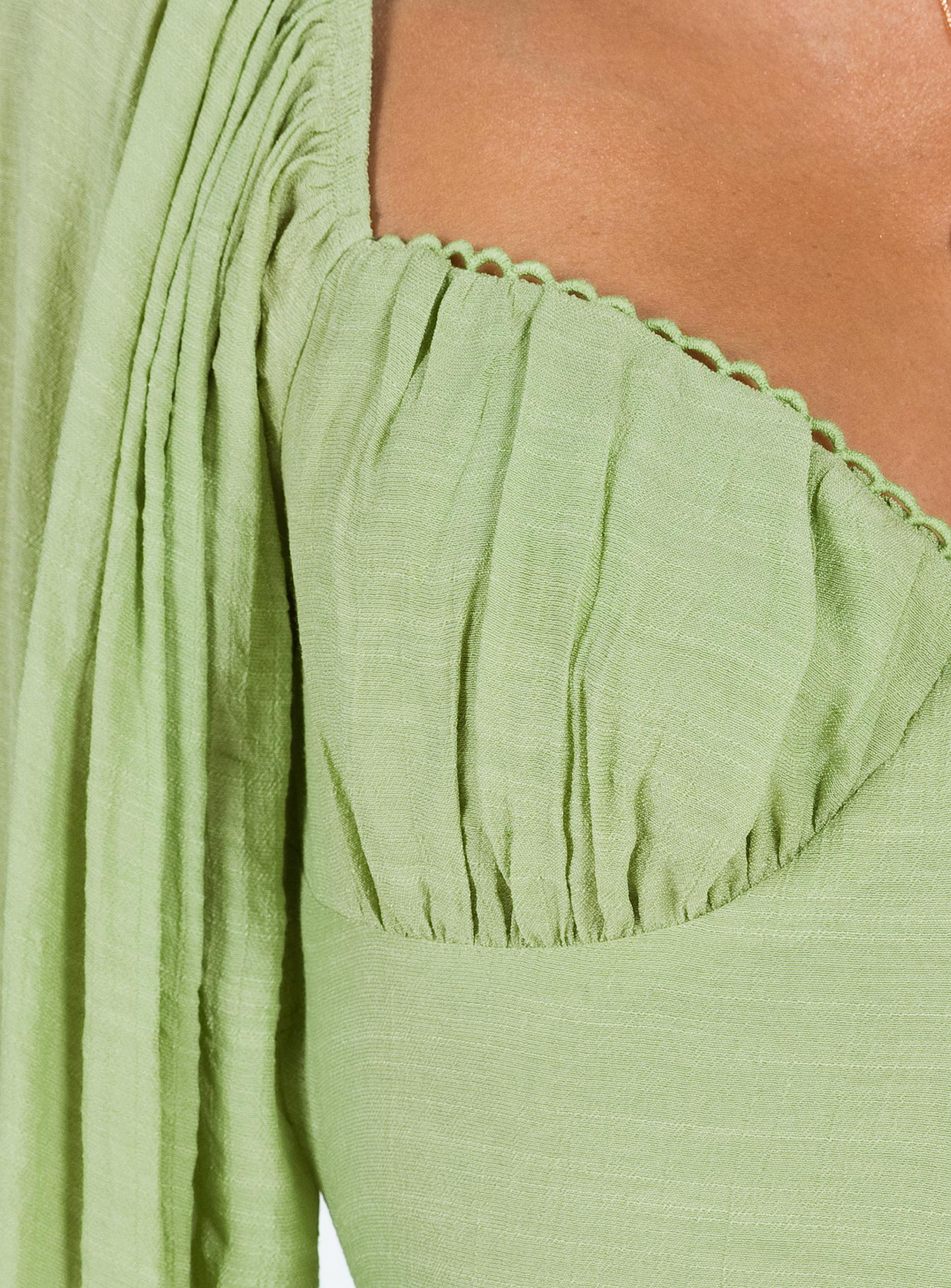 Romper Balloon style sleeves Gathered bust Back tie fastening Low back