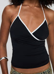 front view of model wearing Princess Polly Kienna Top Black Sleeveless V-Neck 