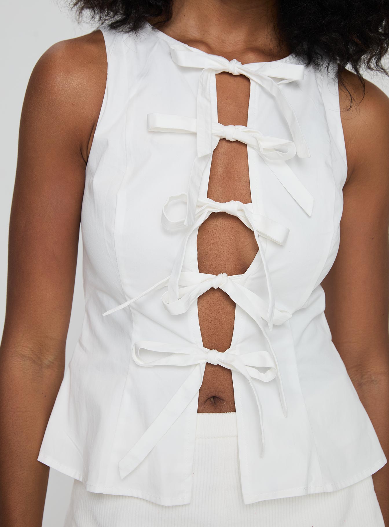 back view of model wearing Princess Polly Luminary Tie Up Top White Sleeveless Crew Neck 