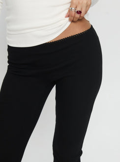 back view of model wearing Princess Polly Baseline Rib Capri Pants Black Petite Mid Rise Pants 
