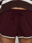 back view of model wearing Princess Polly Moreton Shorts Wine Low Rise Shorts 