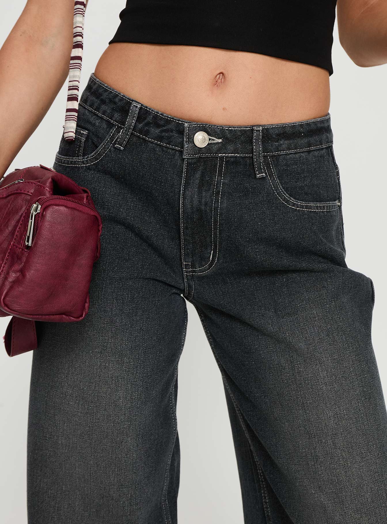 back view of model wearing Princess Polly Ramos Low Rise Wide Leg Jeans Dark Grey Wash Low Rise Jeans 