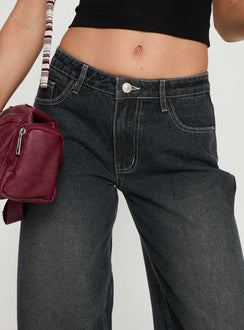 back view of model wearing Princess Polly Ramos Low Rise Wide Leg Jeans Dark Grey Wash Low Rise Jeans 