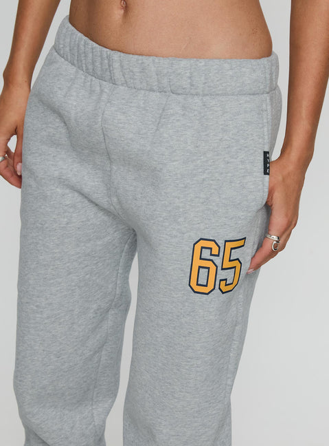 side view of model wearing Princess Polly UC Irvine Basic Sweatpants Grey Mid Rise Pants 
