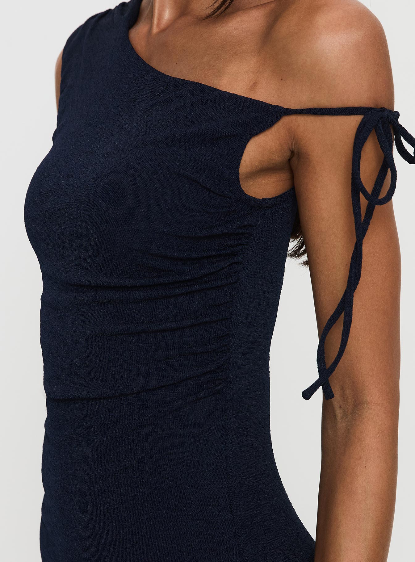 back view of model wearing Princess Polly Paislee Asymmetrical Maxi Dress Navy Asymmetric Neckline 