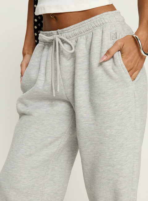 side view of model wearing Princess Polly Caspa Dream Fleece Oversized Ankle Cuff Jogger Grey Marle High Rise Pants 