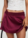 back view of model wearing Princess Polly For Me Mini Skirt Burgundy Mini Skirts 