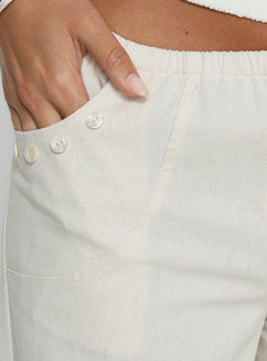 back view of model wearing Princess Polly Around The Clock Button Detail Mid Rise Wide Leg Pants Cream Mid Rise Pants 