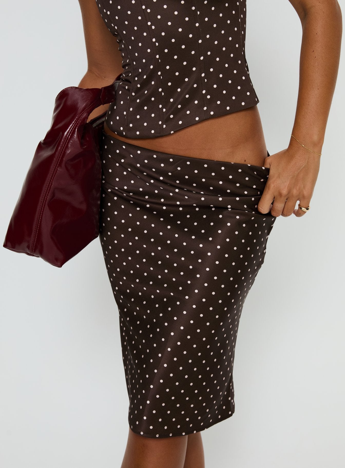 back view of model wearing Princess Polly Somani Satin Midi Skirt Brown / Pink Polka Dot Midi Skirts 