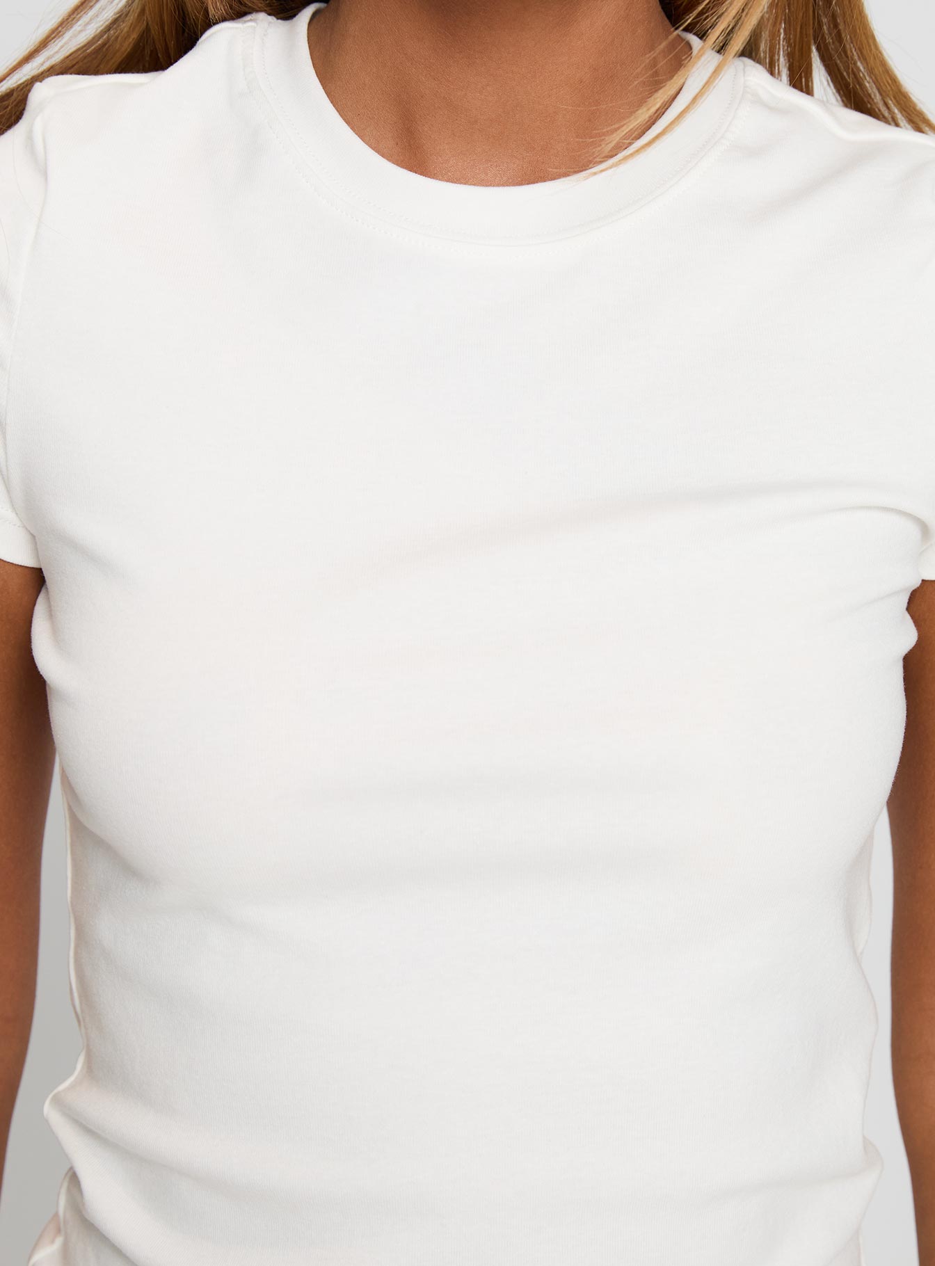 back view of model wearing Princess Polly Prestige Longline Baby Tee Ivory Short Sleeves Crew Neck 