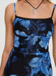 side view of model wearing Princess Polly Kellers Mini Dress Floral Black / Blue Square Neck 