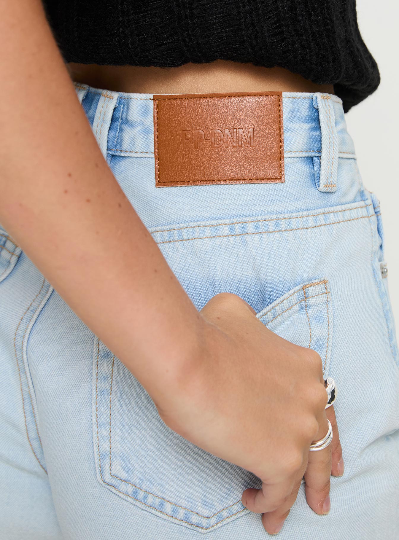 back view of model wearing Princess Polly Get It Right Mid Rise Denim Shorts Light Wash High Waisted Shorts 