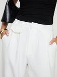 side view of model wearing Princess Polly Jazzar Pocket Detail Pleated Pant White High Waisted Pants 