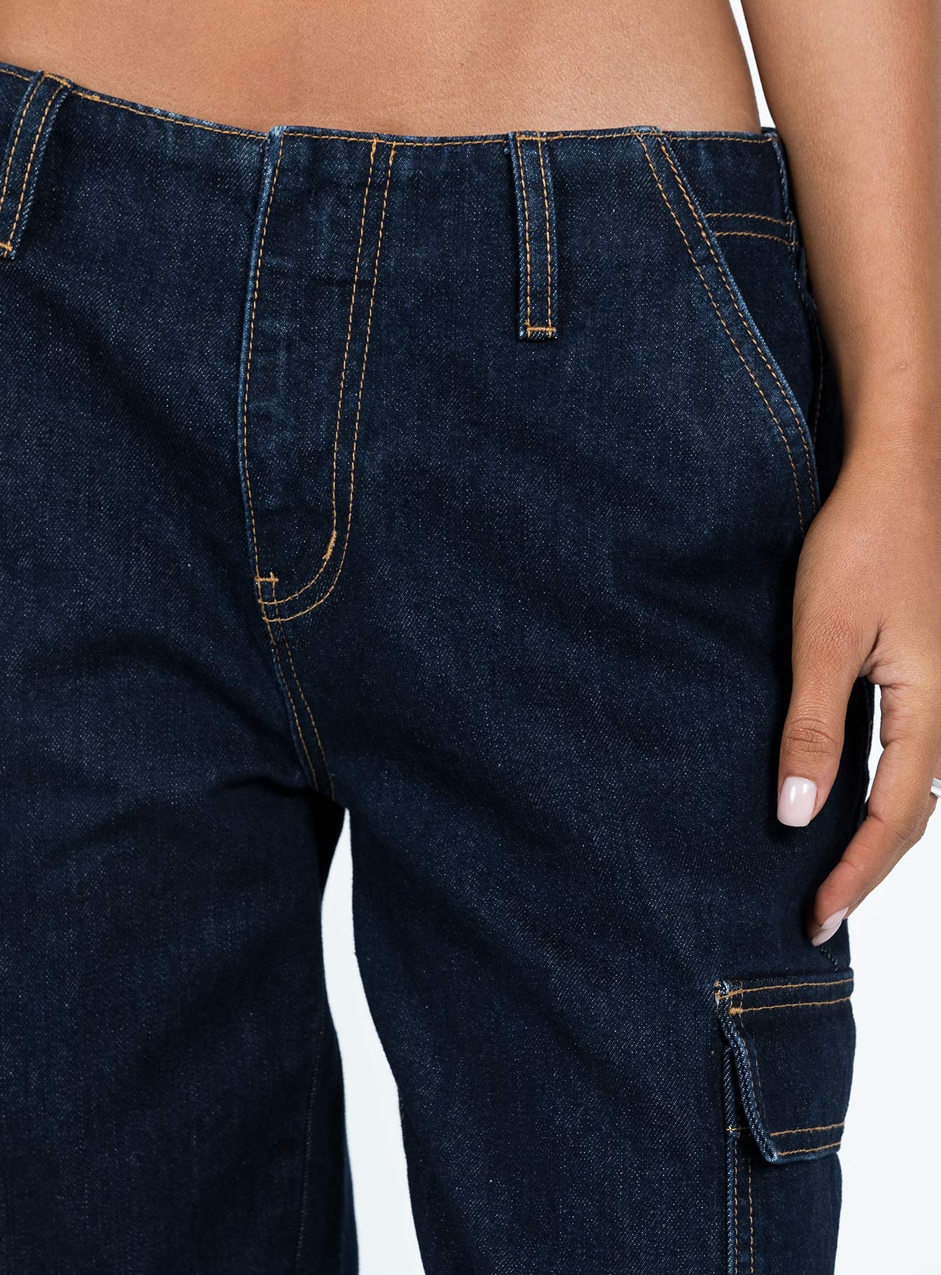 Front view of model wearing  front Princess Polly Mid Rise  Tatini Low Rise Denim Jean Indigo