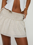 Low rise mini skirt Shirred waistband, tie detail at side Non-stretch material, fully lined