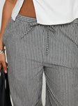 side view of model wearing Princess Polly Veridian Pants Black/White Stripe 