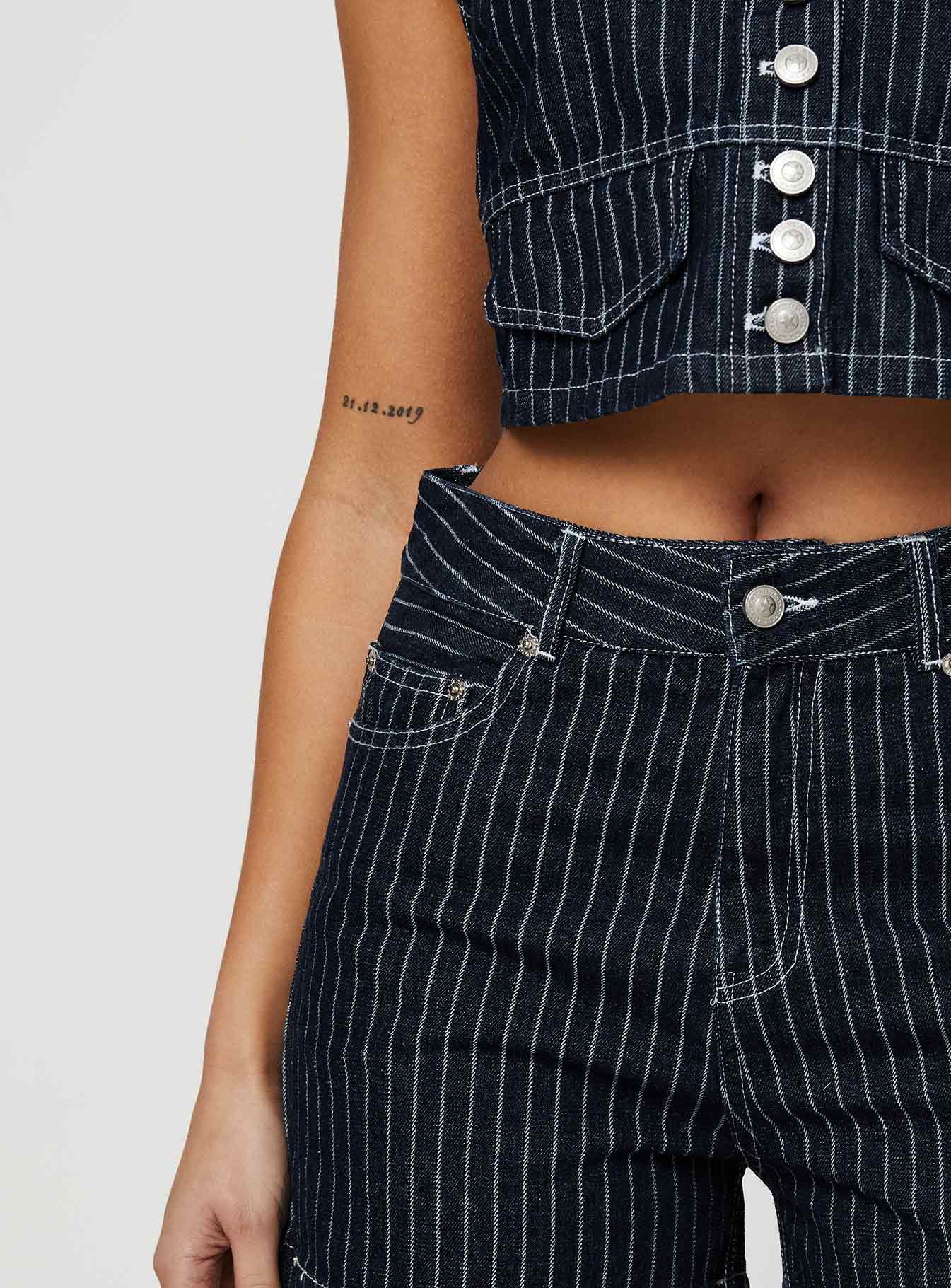 back view of model wearing Princess Polly Rathlyn Pinstripe Shorts Dark Denim High Waisted Shorts 