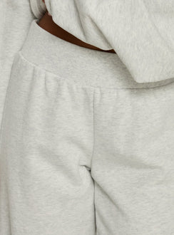 back view of model wearing Princess Polly Peaks Flared Track Pants Snow Marle Mid Rise Pants 