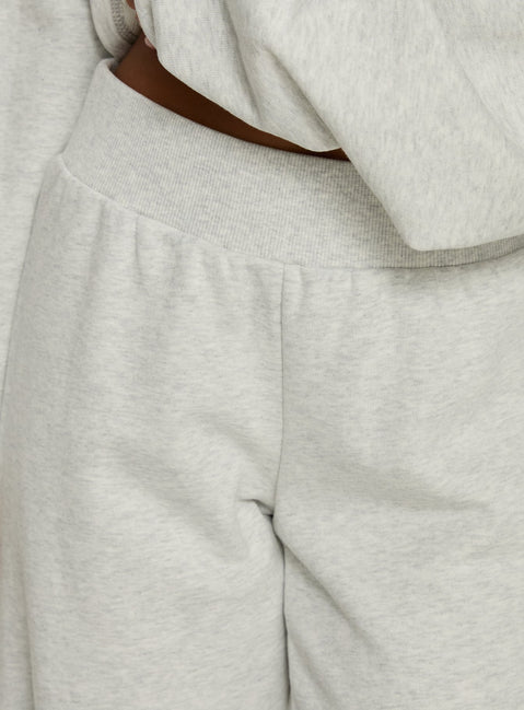 back view of model wearing Princess Polly Peaks Flared Track Pants Snow Marle Mid Rise Pants 