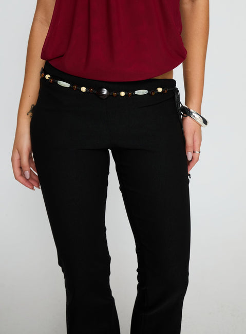 front view of model wearing Princess Polly Krislynn Button Belt Pants Black Mid Rise Pants 