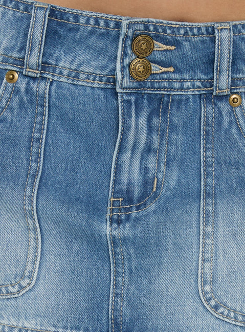 Crafted from the Moving Fast Denim Mini Skirt Mid Blue Wash in womens-skirts with mini length product Princess Polly