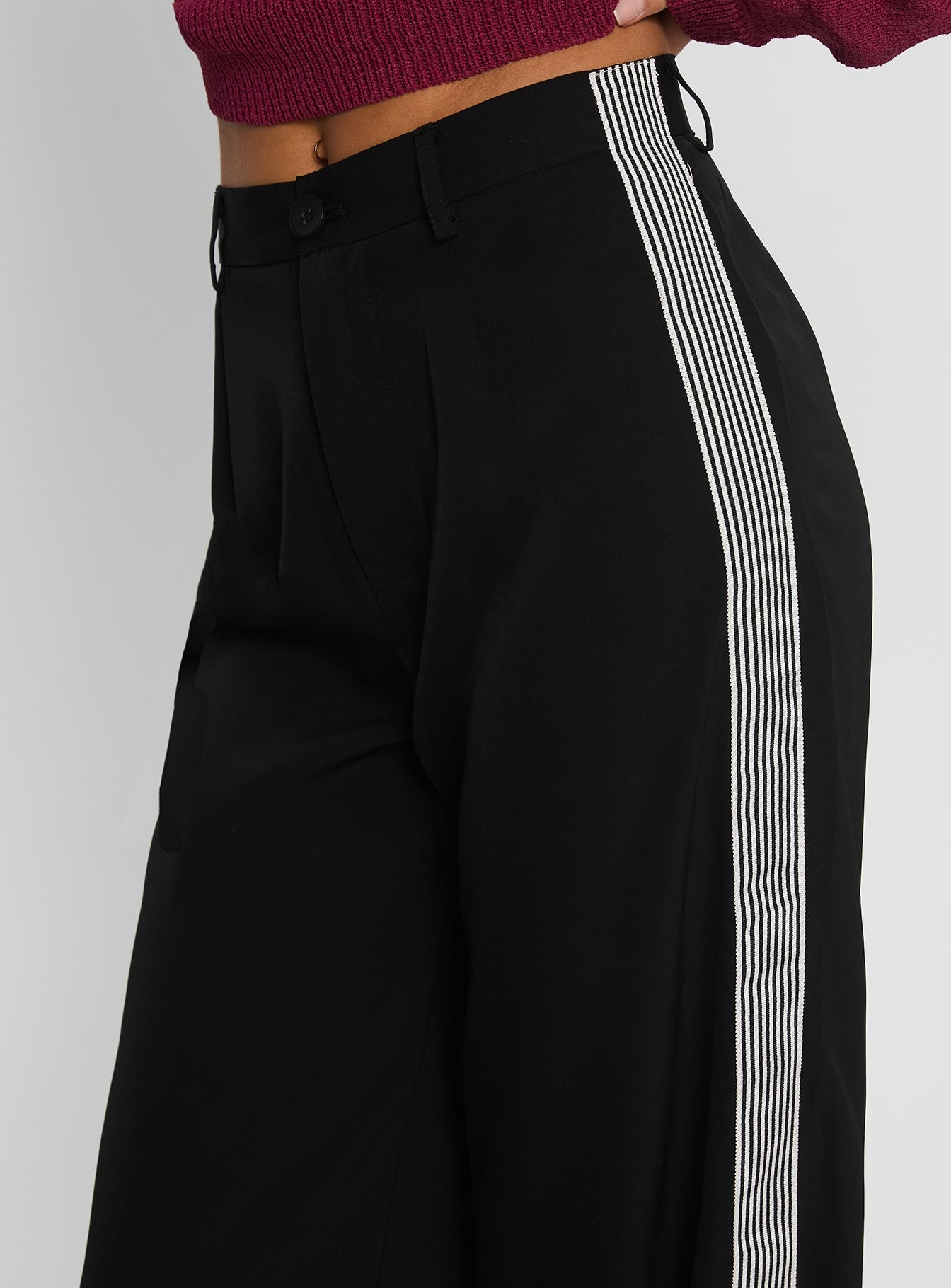 side view of model wearing Princess Polly Fusion Tailored Track Pant Black High Rise Pants 