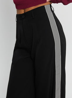 side view of model wearing Princess Polly Fusion Tailored Track Pant Black High Rise Pants 