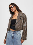 Faux leather cropped jacket Lapel collar, zip front fastening, twin hip pockets, removable buckle belt, belt loops at waist, zip at cuff