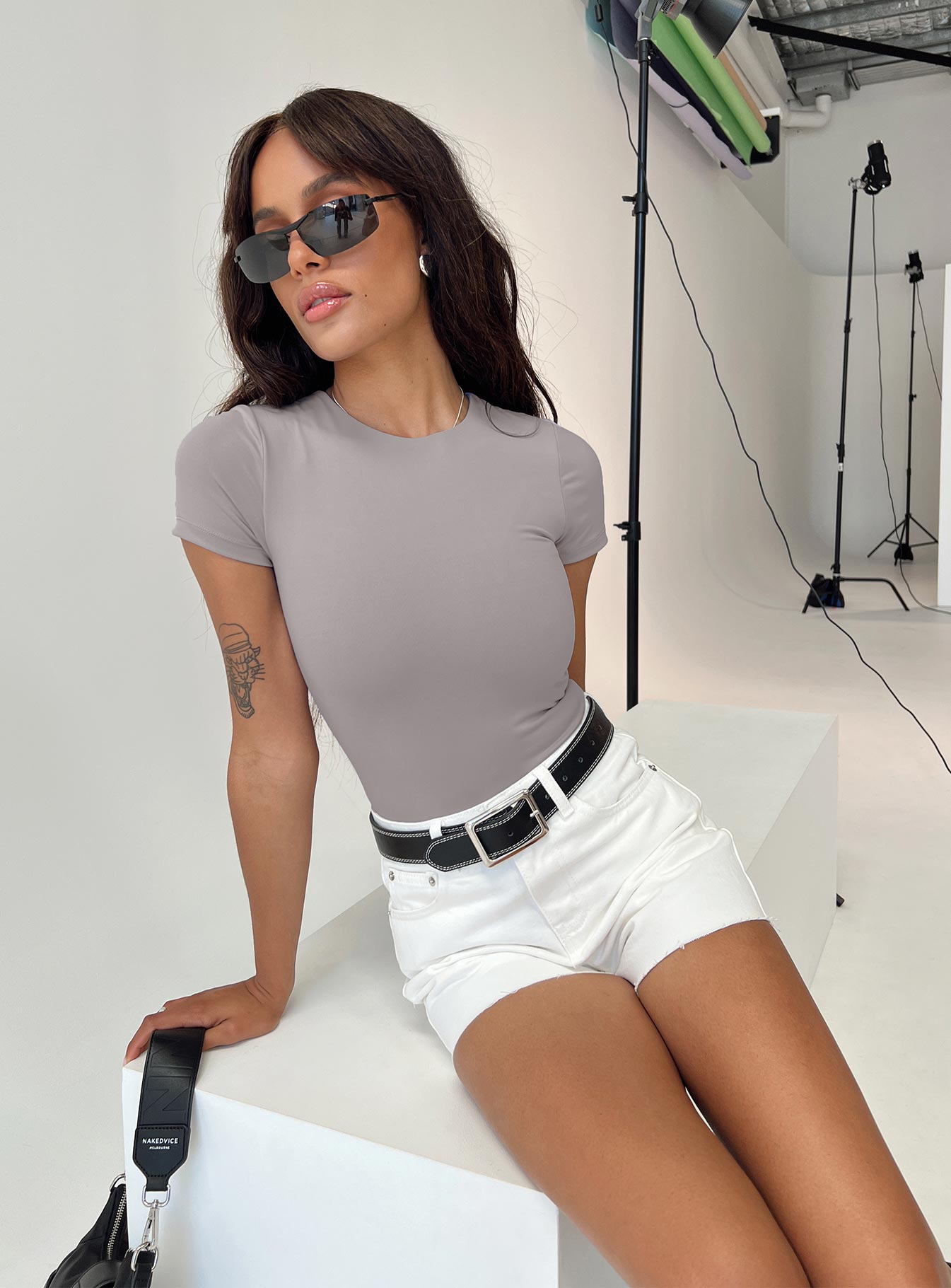 back view of model wearing Princess Polly Jannika Shorts White Denim High Waisted Shorts 