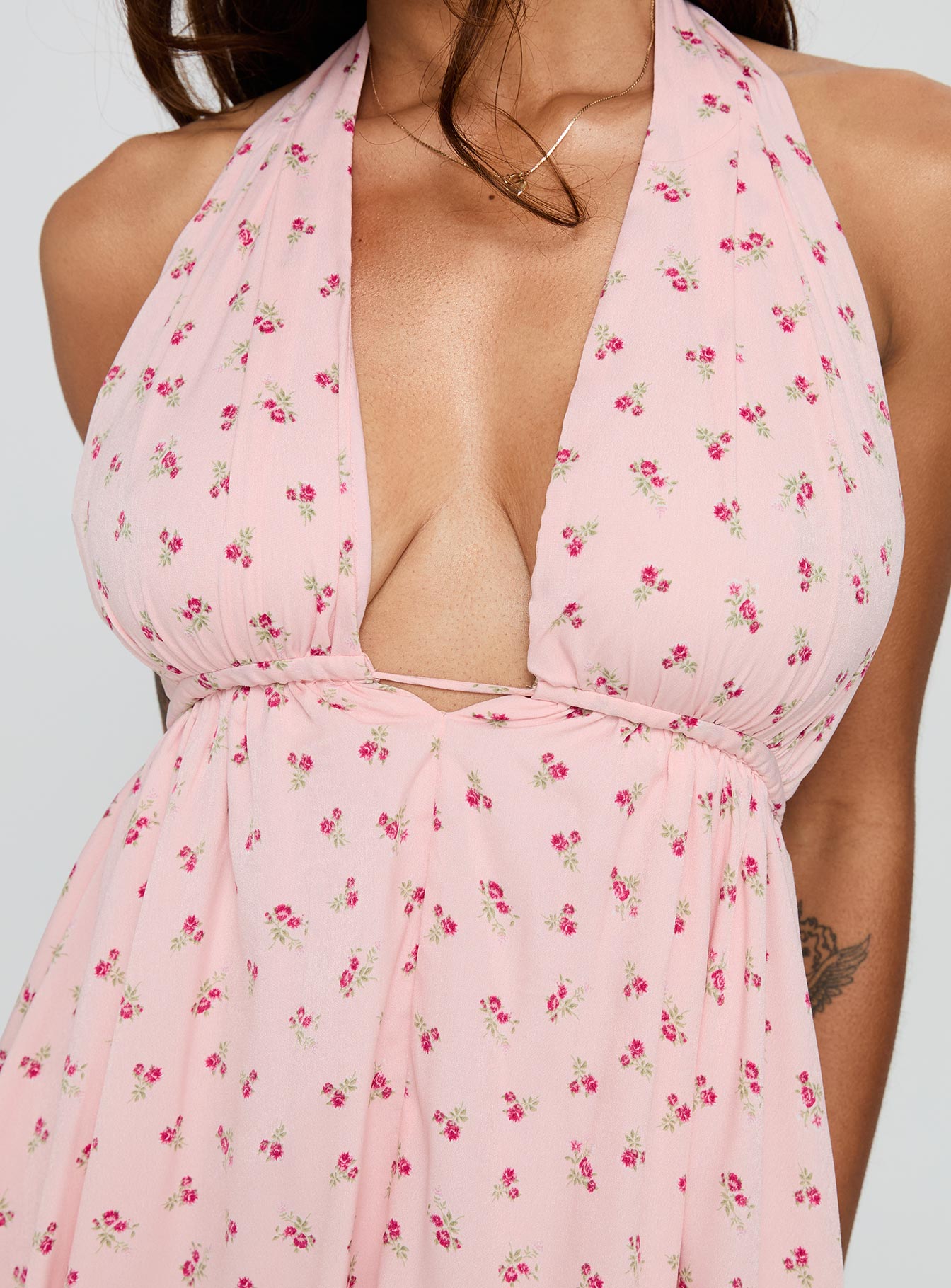 back view of model wearing Princess Polly Saddler Mini Dress Pink Floral Plunger 