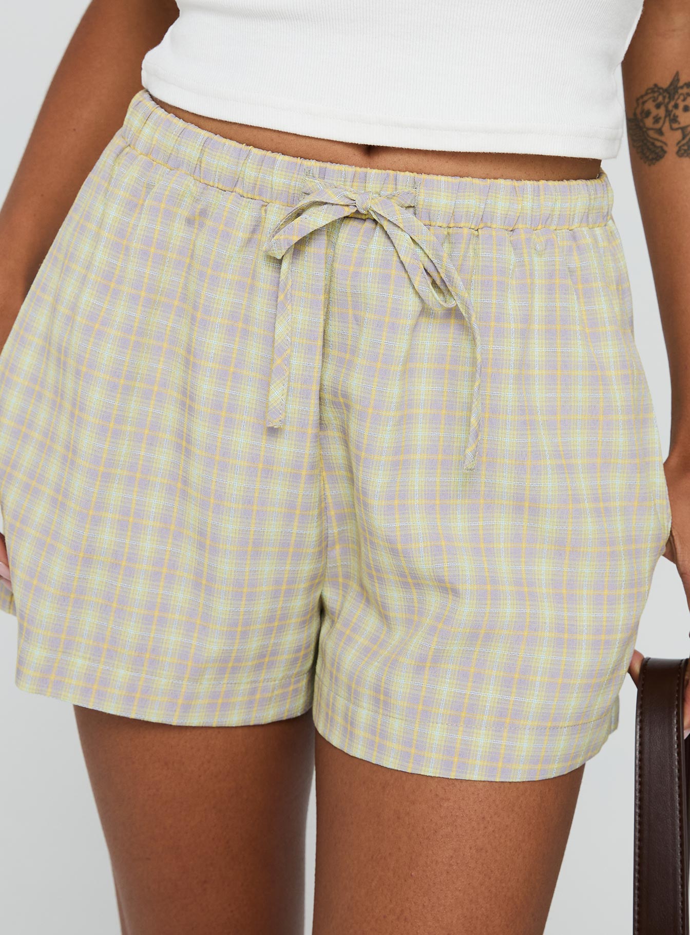 back view of model wearing Princess Polly Star Blaze Shorts Green Check High Waisted Shorts 