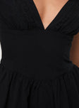 Black Playsuit V neckline, invisible zip fastening at back, pleats at waist, cap sleeve