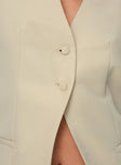 Beige button fastening down front, split hem, faux front pockets