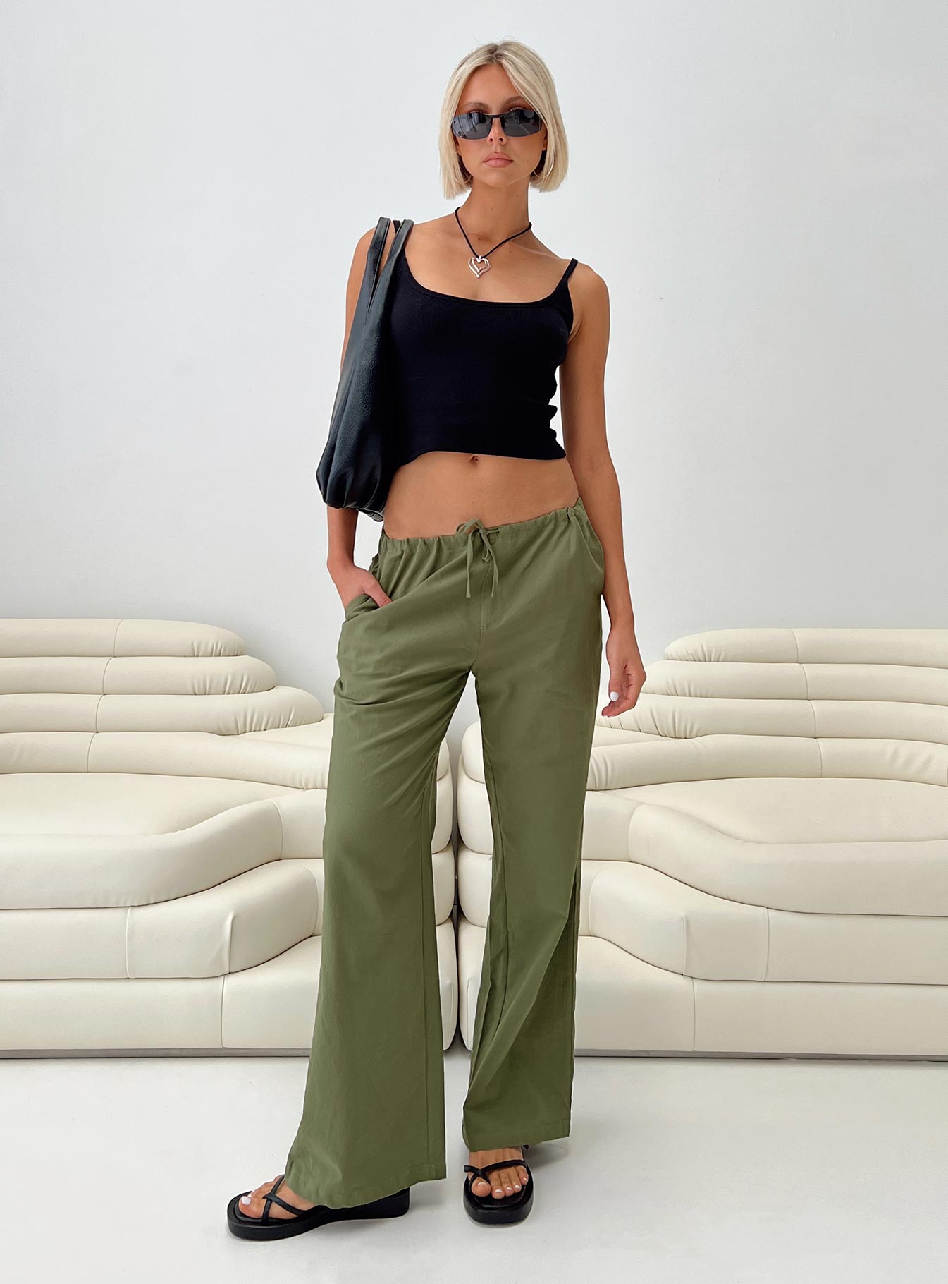 Front view of model wearing  front Princess Polly High Waisted Pants  Nalinee Pants Olive