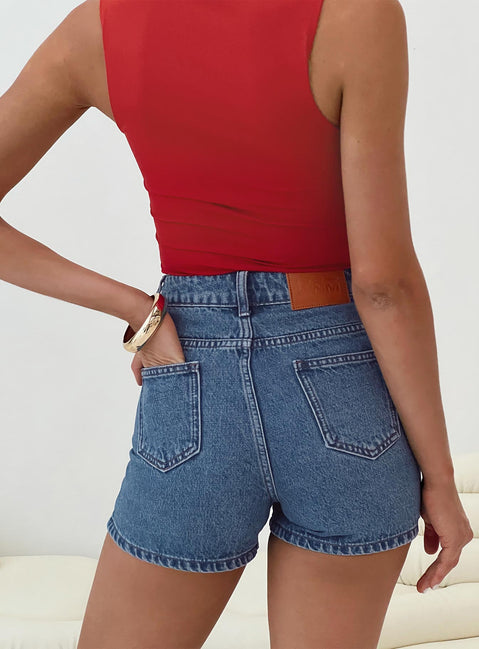 Mid-wash denim shorts High rise, belt looped waist, zip and button fastening, five pockets,  branded patch at back Non-stretch material, unlined 