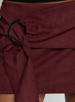   side view of model wearing Princess Polly Lowretta Faux Suede Belt Mini Skirt Burgundy Mini Skirts 
