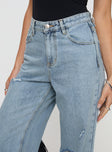 Front view of model wearing  front Princess Polly High Waisted  Beetle Ripped Jeans Light Wash