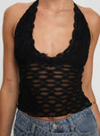 Front view of model wearing  front Princess Polly Sleeveless Scoop Neck  Only Angel Halter Top Black