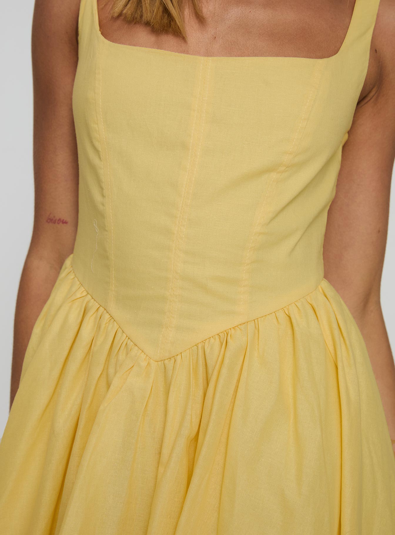front view of model wearing Princess Polly Alcott Bubble Hem Mini Dress Lemon Square Neck 