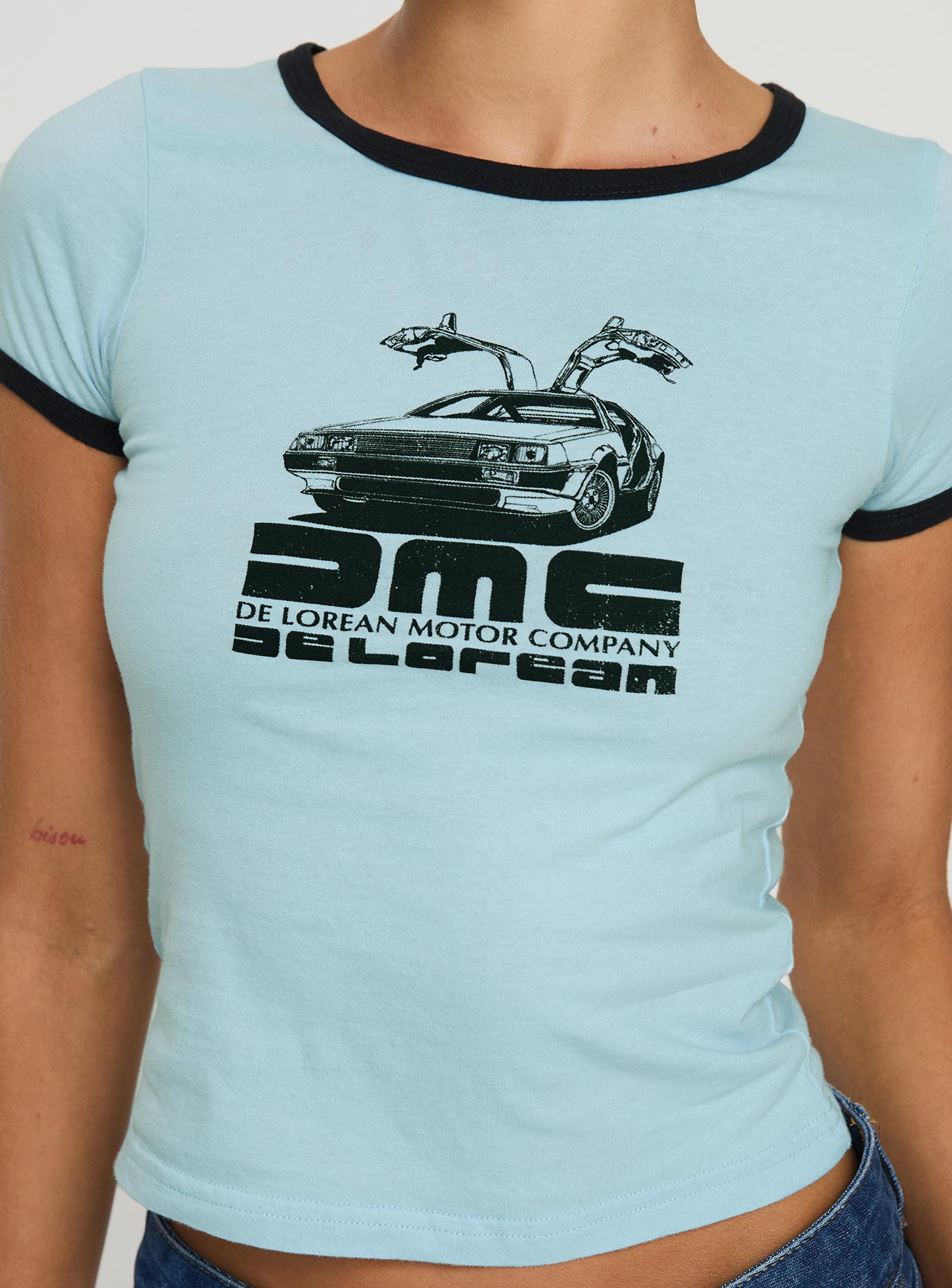 back view of model wearing Princess Polly Delorean Tee Blue Short Sleeves Crew Neck 