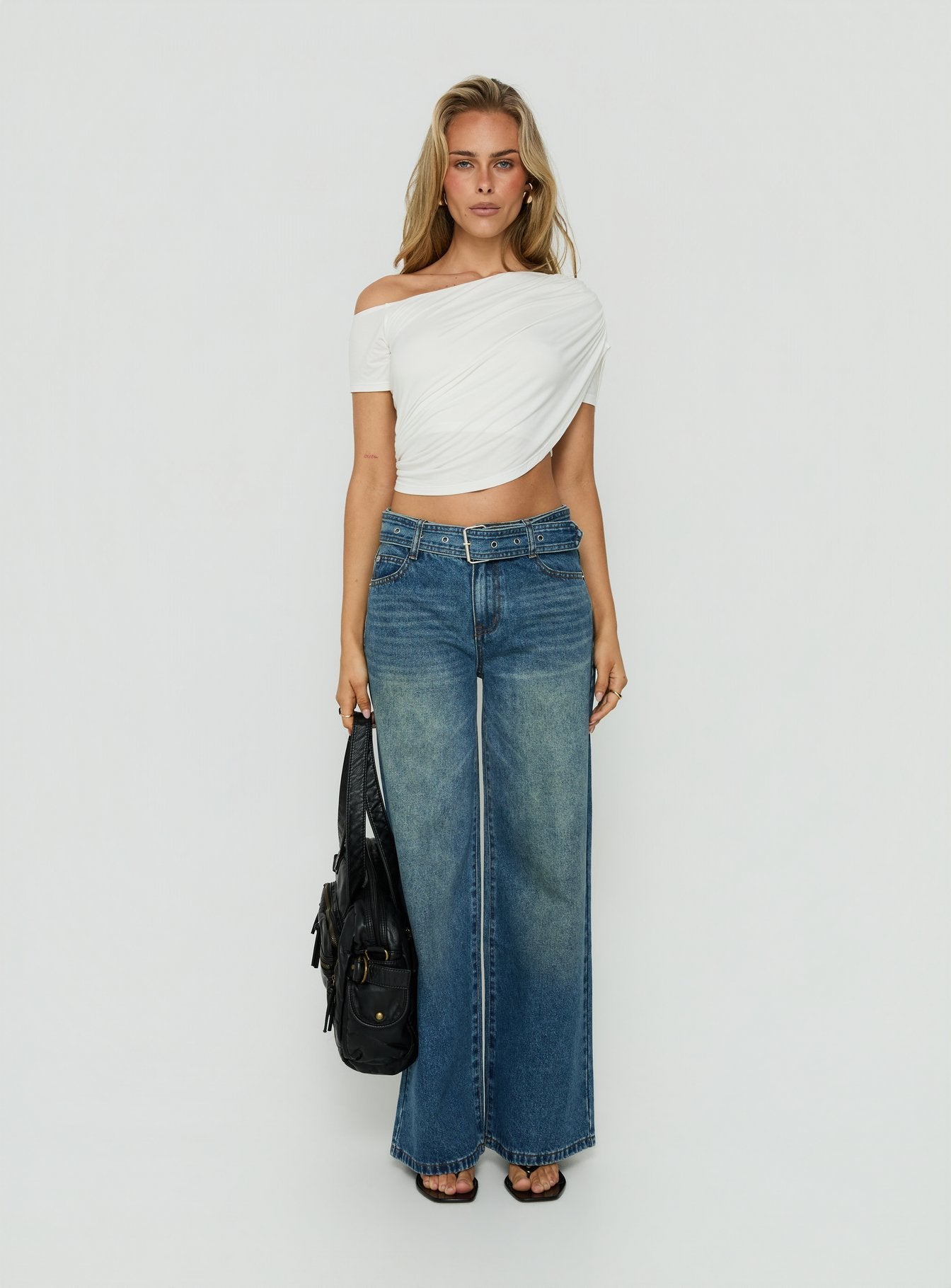 Showcasing Charlotta Low Rise Super Baggy Jeans Mid Blue womens-jeans front view of model wearing Princess Polly